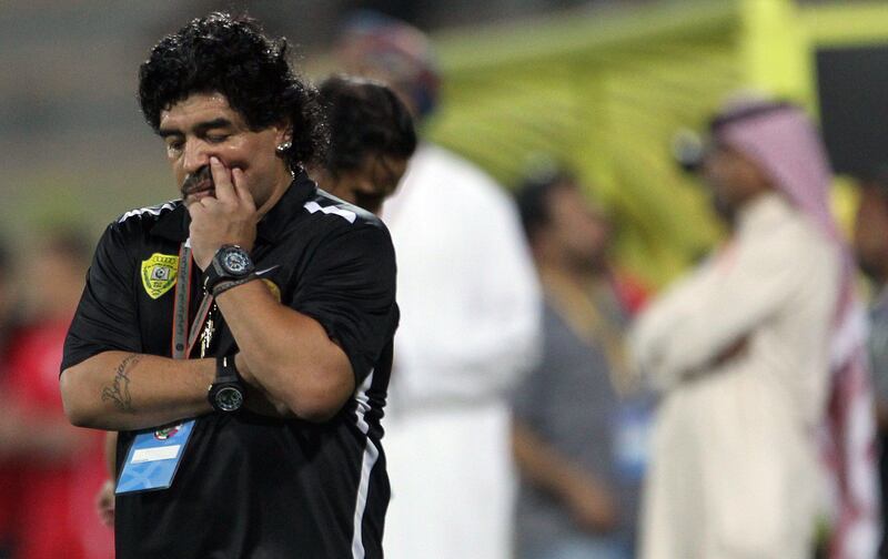 UAE's Al-Wasl club coach Diego Maradona reacts during his team's match against Bahrain's Al-Muharraq club in the final of the GCC Champions League football match in Dubai on June 10, 2012. Muharraq won the championship in penalty 5-4.  AFP PHOTO/KARIM SAHIB
 *** Local Caption ***  733470-01-08.jpg