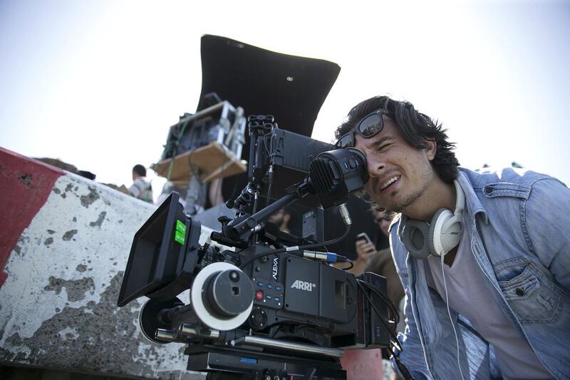 Emirati filmmaker Ali Mostafa on the set of his film, From A to B, at the Corniche in Abu Dhabi. Silvia Razgova / The National