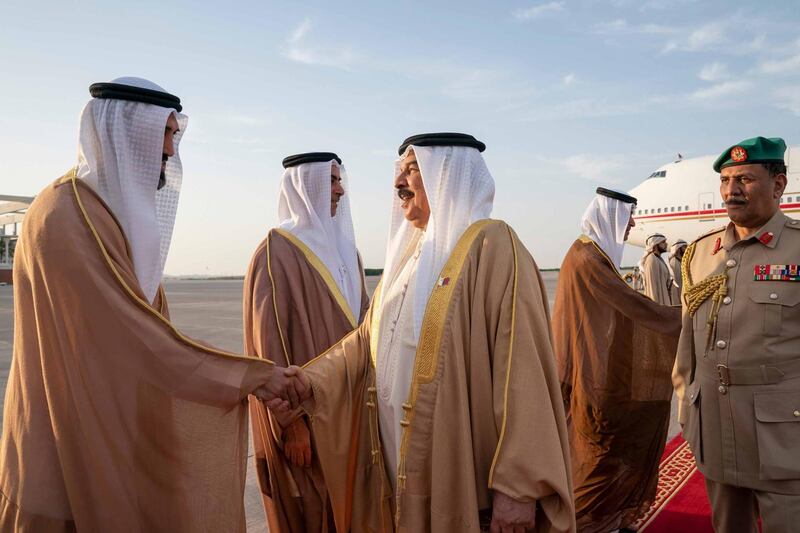 ABU DHABI, UNITED ARAB EMIRATES - May 23, 2019: HE Mohamed Mubarak Al Mazrouei, Undersecretary of the Crown Prince Court of Abu Dhabi (L), greets HM King Hamad bin Isa Al Khalifa, King of Bahrain (C), at Al Bateen Airport. 

( Mohamed Al Hammadi / Ministry of Presidential Affairs )
---