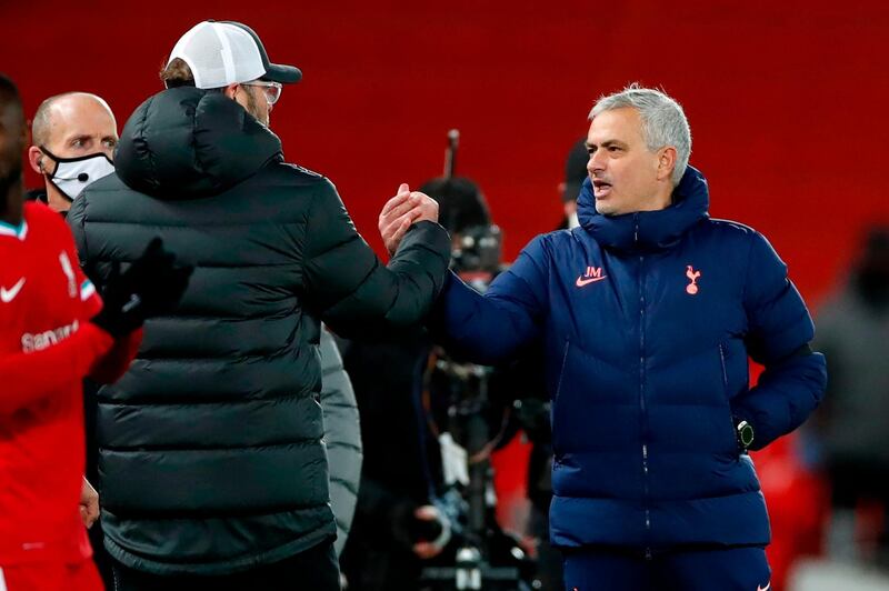 Jurgen Klopp shakes hands with Jose Mourinho. AFP