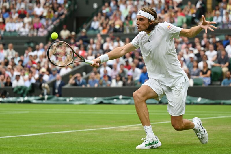 Greece's Stefanos Tsitsipas returns the ball to Australia's Jordan Thompson on his way to a three-set victory in their second-round match. AFP