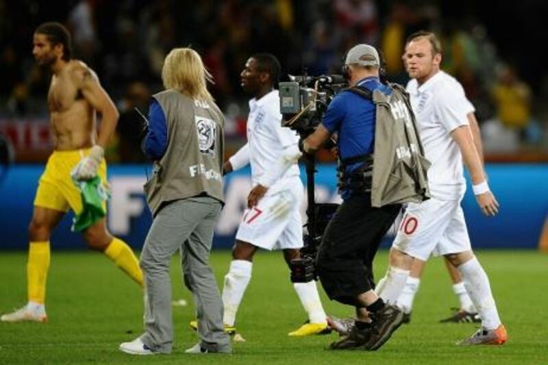 CAPE TOWN, SOUTH AFRICA - JUNE 18:  Wayne Rooney of England speaks to a cameraman as he walks off the pitch dejected after the 2010 FIFA World Cup South Africa Group C match between England and Algeria at Green Point Stadium on June 18, 2010 in Cape Town, South Africa.  (Photo by Laurence Griffiths/Getty Images) *** Local Caption ***  GYI0060803072.jpg