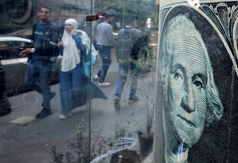 A currency exchange point in Cairo. The devaluation of the Egyptian pound in early March brought its value against the US dollar down by 38 per cent. Reuters