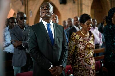 Congolese opposition presidential candidate Martin Fayulu attends a prayer service at Notre Dame du Congo cathedral in Kinshasa, Congo, Saturday Dec. 29, 2018.  Congolese people are heading to the polls Sunday Dec. 30, for a presidential race plagued by years of delay and persistent rumours of lack of preparation. (AP Photo/Jerome Delay)