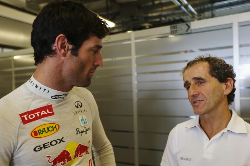 ABU DHABI, UNITED ARAB EMIRATES - NOVEMBER 02:  Mark Webber of Australia and Red Bull Racing talks with former F1 World Champion Alain Prost as he prepares to drive during practice for the Abu Dhabi Formula One Grand Prix at the Yas Marina Circuit on November 2, 2012 in Abu Dhabi, United Arab Emirates.  (Photo by Mark Thompson/Getty Images) *** Local Caption ***  155222988.jpg