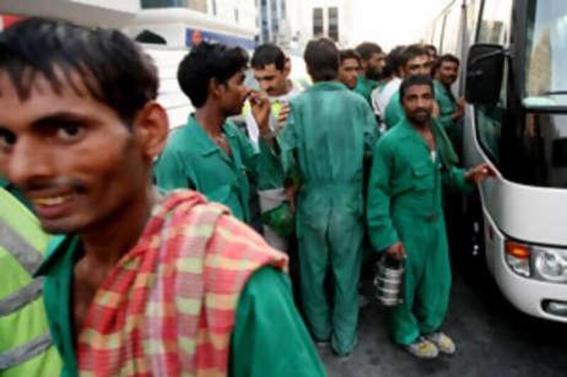 Labourers like these men in Abu Dhabi stand to benefit from human rights reforms.