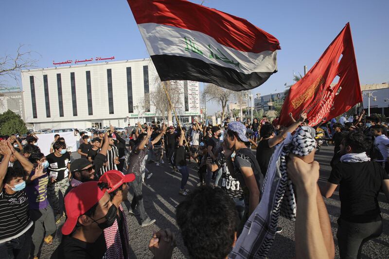 Anti-government protesters gather for a demonstration demanding free elections and against corruption outside the provincial council building, in Basra, Iraq. AP Photo