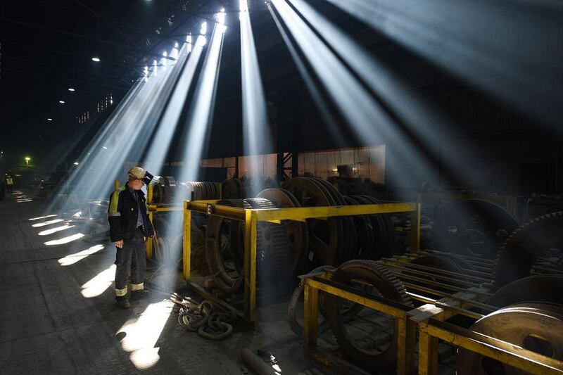 An employee inspects engineering spares in the melt shop. Oli Scarff / AFP