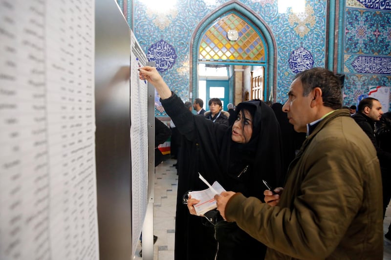 Iranians fill in their ballot papers at a polling station during the parliamentary elections in Tehran, Iran on 21 February 2020. Iranians head to polls amid a worsening economic crisis and escalating tensions with the United States.  EPA