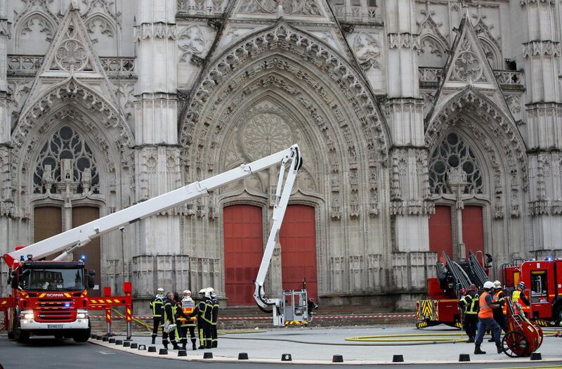 Firefighters work at the scene of a blaze at the cathedral. Reuters