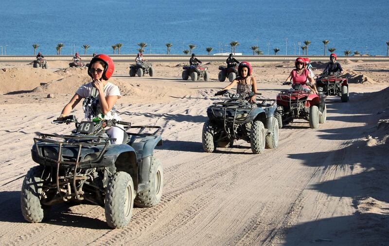 Tourists take part in a quad tour in the desert near the Red Sea resort town of Dahab, 550km east of Cairo in the Sinai Peninsula, Egypt.  EPA