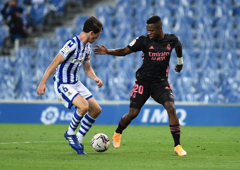 Real Madrid forward Vinicius Junior takes on Aihen Munoz of Real Sociedad. Getty Images