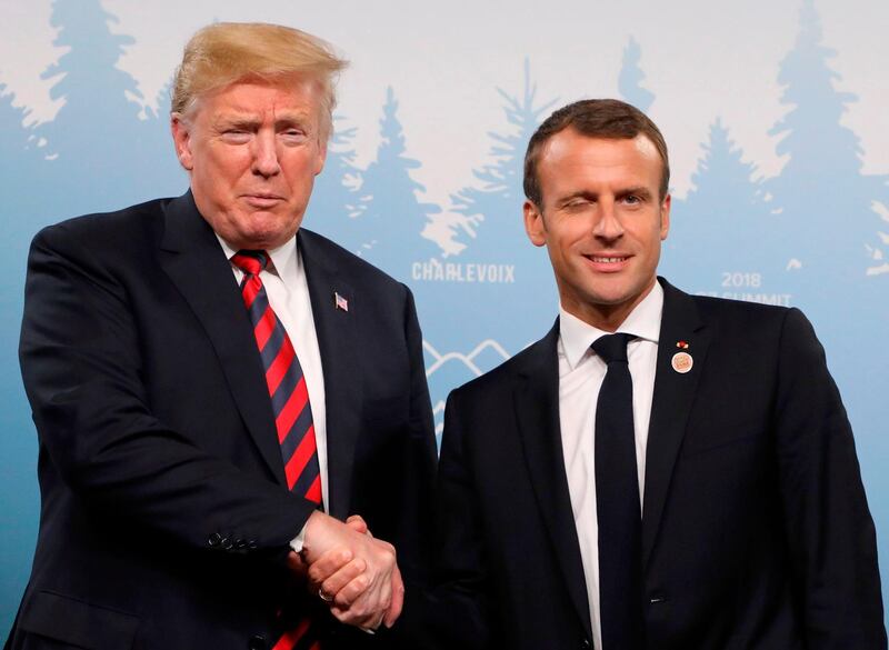 US President Donald Trump and French President Emmanuel Macron shake hands at a meeting on the sidelines of the G7 Summit in La Malbaie, Quebec, Canada. Ludovic Marin / AFP
