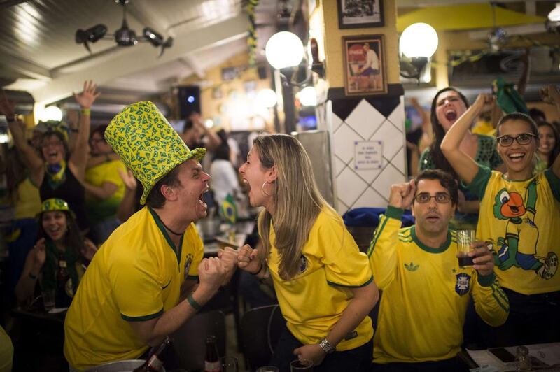 Brazilian fans watch the opening match of the 2014 Fifa World Cup between Brazil and Croatia. Martin Bureau / AFP Photo