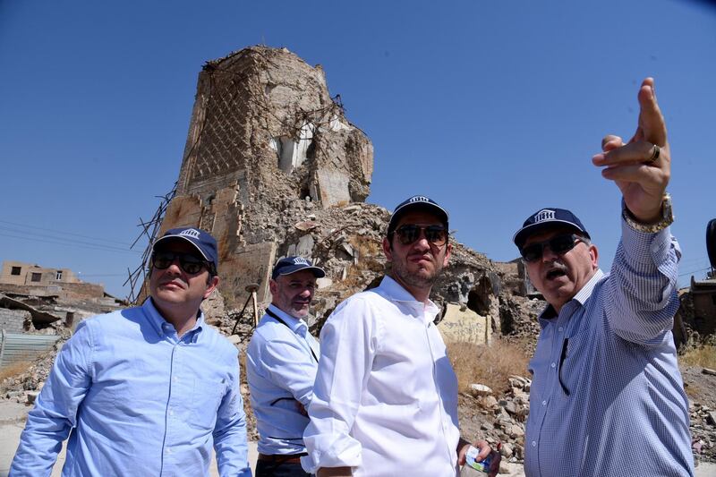 Unesco inspectsors at the Al Nuri Mosque. The UAE is donating Dh185m to help fund the five-year reconstruction project.  EPA