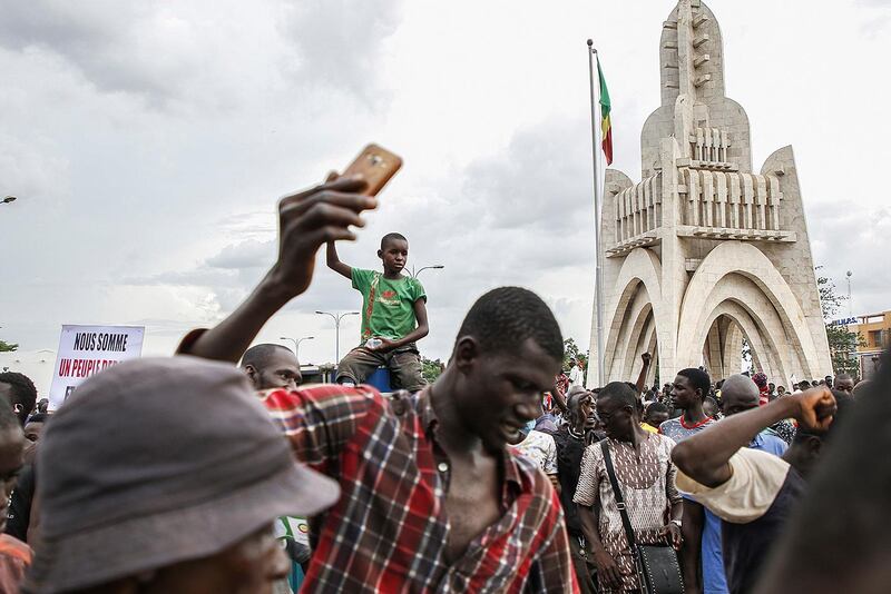 Malians react after Mali military entered the streets of Bamako, Mali 18 August 2020.  EPA