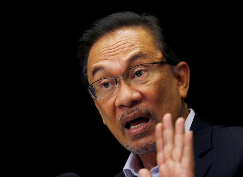FILE PHOTO: Malaysia's opposition leader Anwar Ibrahim speaks to the media in Kuala Lumpur February 4, 2015. REUTERS/Olivia Harris/File Photo