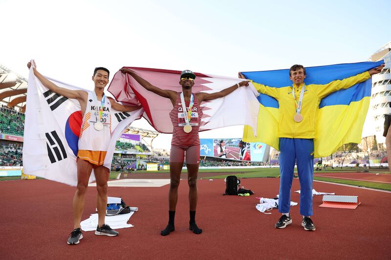 L-R: Silver medalist Sanghyeok Woo, gold medalist Mutaz Essa Barshim, and bronze medalist Andriy Protsenko. Getty
