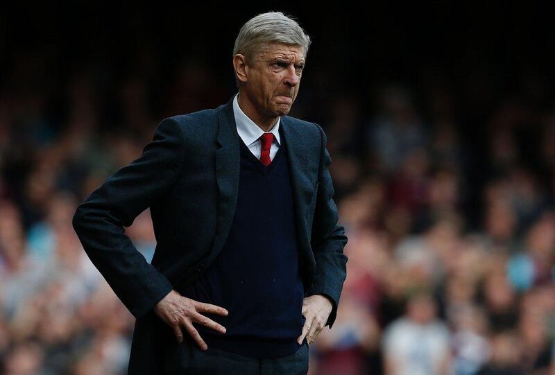 Arsenal manager Arsene Wenger reacts during his team's 3-3 draw against West Ham United in the Premier League on Saturday. Ian Kington / AFP / April 9, 2016 