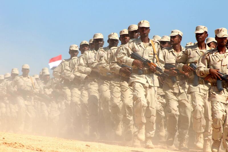 Yemeni pro-government forces on parade as Saudi and US ambassadors to Yemen arrive at Mukalla airport. AFP