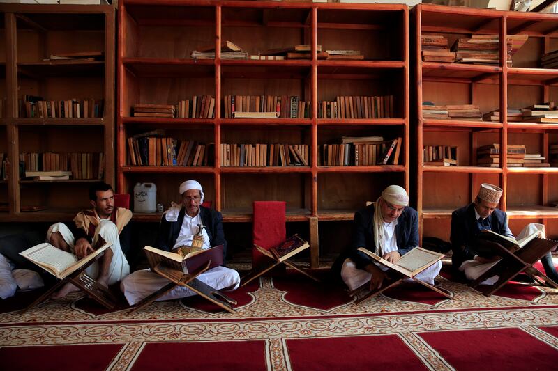 Yemenis read the Quran during Ramadan at a mosque in the old city of Sanaa, Yemen. EPA