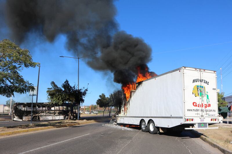 Vehicles across the city were set on fire by members of the drug gangs. Reuters