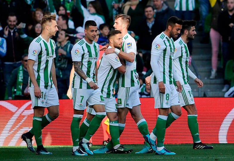 Real Betis' Spanish forward Loren (L) celebrates after scoring a goal during the Spanish league football match between Real Betis and Villarreal CF at the Benito Villamarin stadium in Sevilla on February 03, 2018. 
Betis won 2-1. / AFP PHOTO / CRISTINA QUICLER