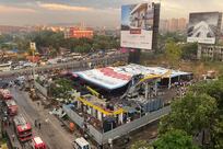 At least 14 killed and 74 hurt after advertising hoarding collapses in Mumbai during storm