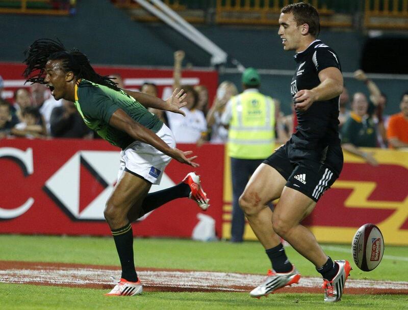 Seabelo Senatla of South Africa scores a try during his team's win in the Trophy Semi-Final against New Zealand on Saturday at Dubai Sevens. Karim Sahib / AFP