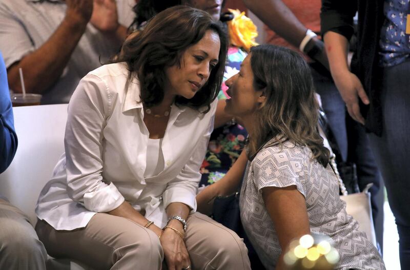 DES MOINES, IOWA - AUGUST 10: Democratic presidential hopeful U.S. Sen. Kamala Harris (L) (D-CA) talks with her aide Julie Chavez Rodriguez (R) during the Asian and Latino Coalition event at Jasper Winery on August 10, 2019 in Des Moines, Iowa. Kamala Harris is on a five day river-to-river bus tour across Iowa promoting her "3AM Agenda" to Iowans.   Justin Sullivan/Getty Images/AFP