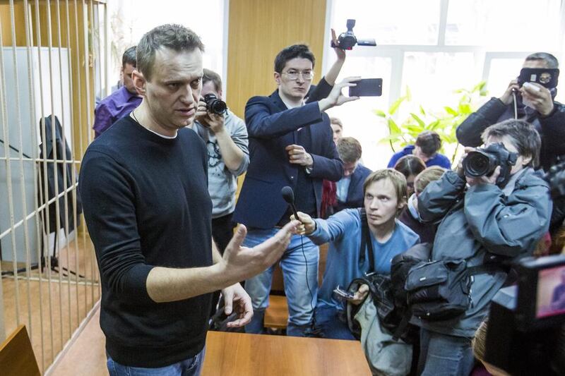 Russian opposition leader Alexei Navalny, foreground, speaking to press in a court room in Moscow, Russia on March 27, 2017 after his arrest for organising protests which the Kremlin called 'a provocation and a lie'.  Denis Tyrin/AP Photo