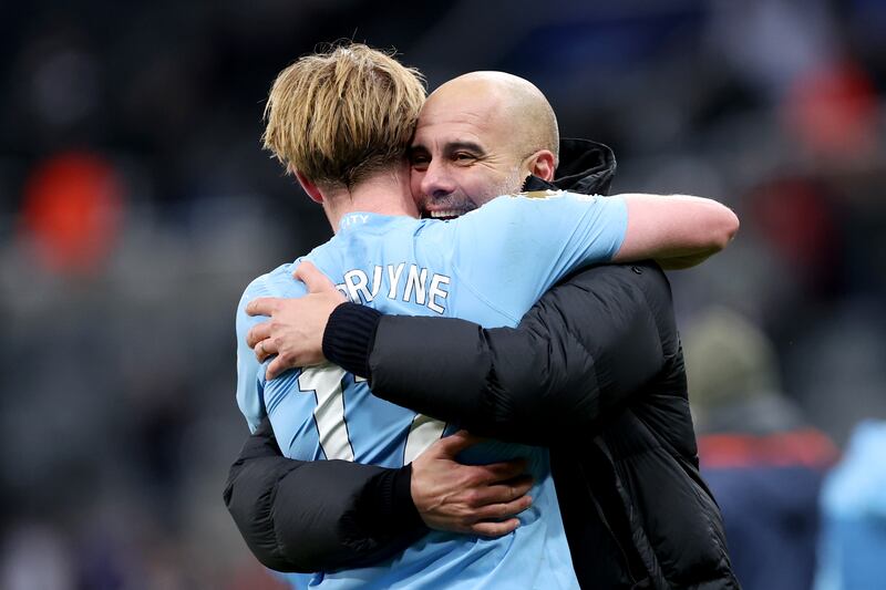 City manager Pep Guardiola hugs Kevin De Bruyne after the match. Getty Images