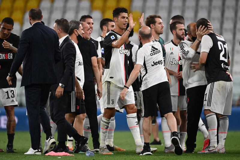 Ronaldo (C) celebrates with his teammates. AFP