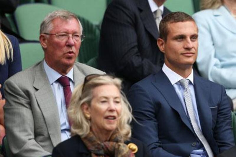 Sir Alex Ferguson, left, and Nemanja Vidic, of Manchester United, were at Centre Court to watch Andy Murray play. Clive Brunskill / Getty Images