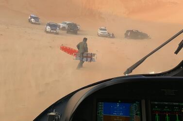 A land and air rescue operation was launched after a car accident in the Abu Dhabi desert left three people injured. Courtesy Abu Dhabi Police