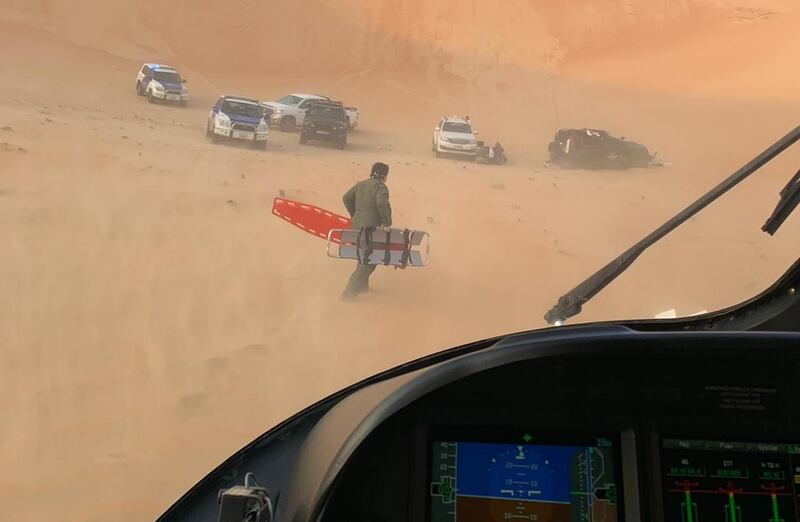 A land and air rescue operation was launched after a car accident in the Abu Dhabi desert left three people injured. Courtesy Abu Dhabi Police