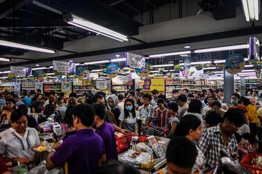 Shoppers stock up on groceries in Yangon in Myanmar. Panic buying has spread across the globe as people try to prepare for the effects of coronavirus. AP