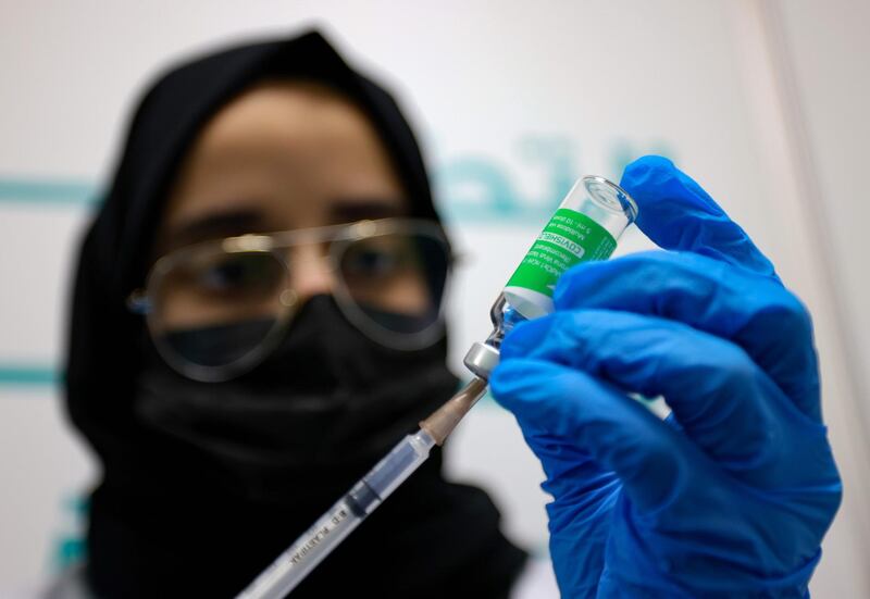 A health worker prepares an injection of the Pfizer-BioNTech vaccine against the coronavirus at a vaccination centre, set up at the Dubai International Financial Center in the Gulf emirate of Dubai, on February 3, 2021.  The United Arab Emirates, which includes Dubai and six other emirates, has suffered a spike in cases after the holiday period.
It was among the first to launch a vast vaccination campaign in December 2020 for its population of nearly 10 million and has administered at least three million doses to more than a quarter of its population, second only to Israel in the global race, according to the German data agency Statista.
 / AFP / Karim SAHIB
