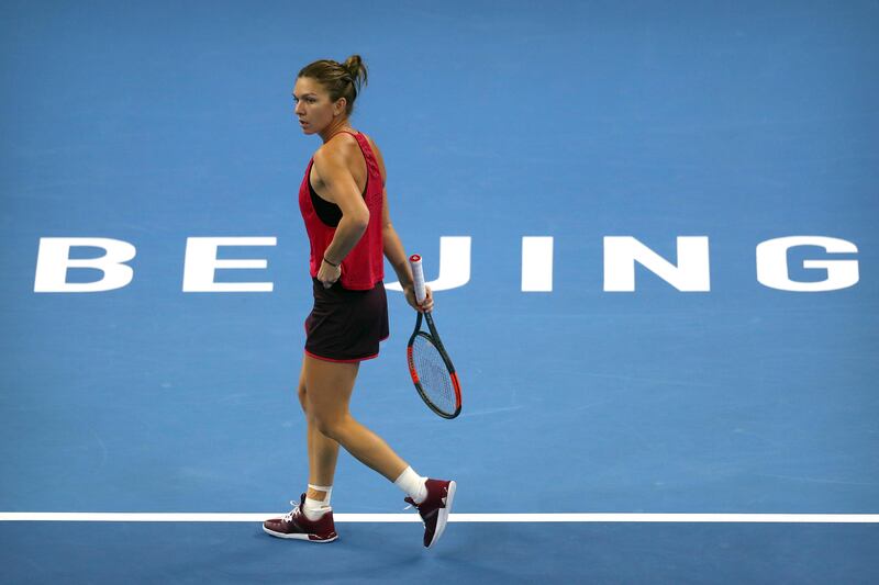 Simona Halep of Romania reacts during her women's singles championship match against Caroline Garcia of France in the China Open tennis tournament at the Diamond Court in Beijing, Sunday, Oct. 8, 2017. (AP Photo/Mark Schiefelbei