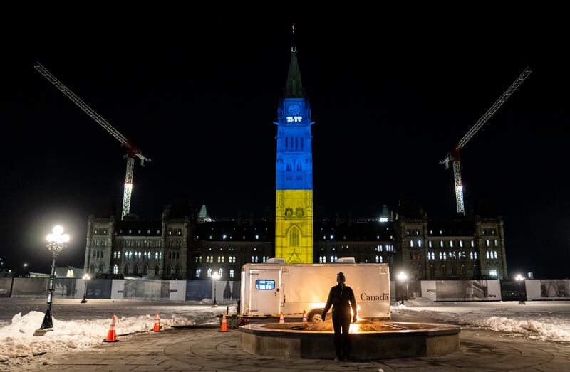 The Peace Tower on Parliament Hill in Ottawa, Canada, is lit up with the colours of Ukraine’s national flag in a show of support. AP