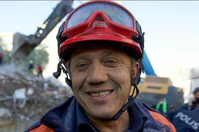 A handout picture taken and released on November 2, 2020 by Istanbul fire department shows Muammer Celik, the fireman who saved Elif Perincek, a three-year-old survivor, out of a collapsed building after an earthquake in the Aegean port city of Izmir. Rescue workers were searching eight buildings in Izmir despite dwindling hope for survivors, as the death toll of a powerful magnitude earthquake which hit western Turkey rose to 69. The 7.0-magnitude quake has also injured 896 in Turkey, the Turkish emergency authority AFAD said, after striking on October 30, afternoon near the west coast town of Seferihisar in Izmir province.
 - RESTRICTED TO EDITORIAL USE - MANDATORY CREDIT "AFP PHOTO /ISTANBUL FIRE DEPARTMENT/SERKAN OKTAR " - NO MARKETING - NO ADVERTISING CAMPAIGNS - DISTRIBUTED AS A SERVICE TO CLIENTS
 / AFP / ISTANBUL FIRE DEPARTMENT / Serkan OKTAR / RESTRICTED TO EDITORIAL USE - MANDATORY CREDIT "AFP PHOTO /ISTANBUL FIRE DEPARTMENT/SERKAN OKTAR " - NO MARKETING - NO ADVERTISING CAMPAIGNS - DISTRIBUTED AS A SERVICE TO CLIENTS
