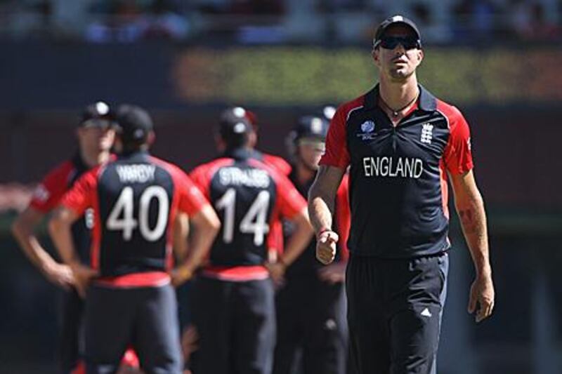 Kevin Pietersen of England walks away from the rest of the team during England's Group B match against South Africa. The batsman will now leave the World Cup squad to recover ahead of the IPL.