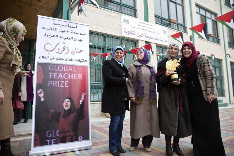 Colleagues at the Samiha Kahlil school in Al Bireh, just outside Ramallah, welcome back Hanan Al Hroub, the winner of this year’s Global Teacher Prize. Heidi Levine for The National