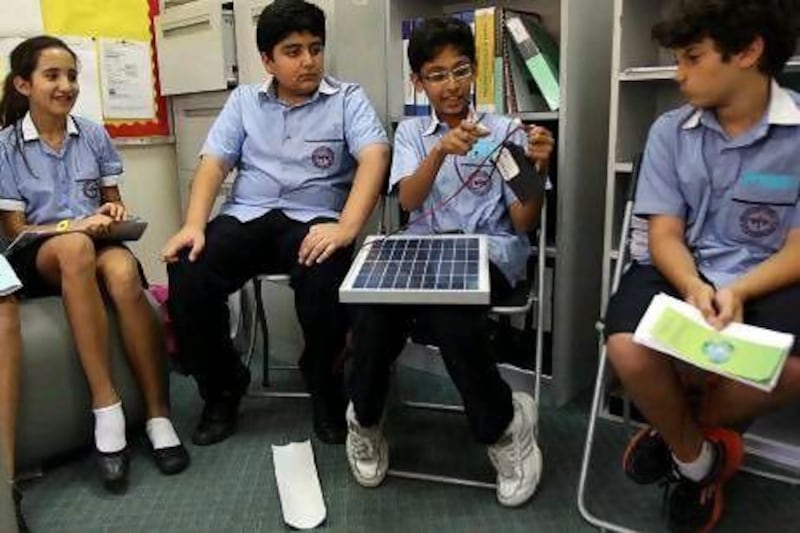 From left: Yasmin Dajani, 11, Saif Abdulrab, 12, Varun Kitson, 11, and Jake Milad, 11, are learning to convert knowledge - in this case, about alternative energy - into practical applications.