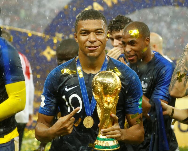 Soccer Football - World Cup - Final - France v Croatia - Luzhniki Stadium, Moscow, Russia - July 15, 2018  France's Kylian Mbappe celebrates with the trophy after winning the World Cup  REUTERS/Kai Pfaffenbach