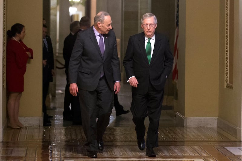epa06503907 Senate Minority Leader Chuck Schumer (R) and Senate Majority Leader Mitch McConnell (L) walk to the Senate floor during a photo opportunity in the US Capitol in Washington, DC, USA, 07 February 2018. Senate leaders have reached a two year budget deal, adding billions of dollars in federal spending but paving the way forward to address other pending issues.  EPA/SHAWN THEW