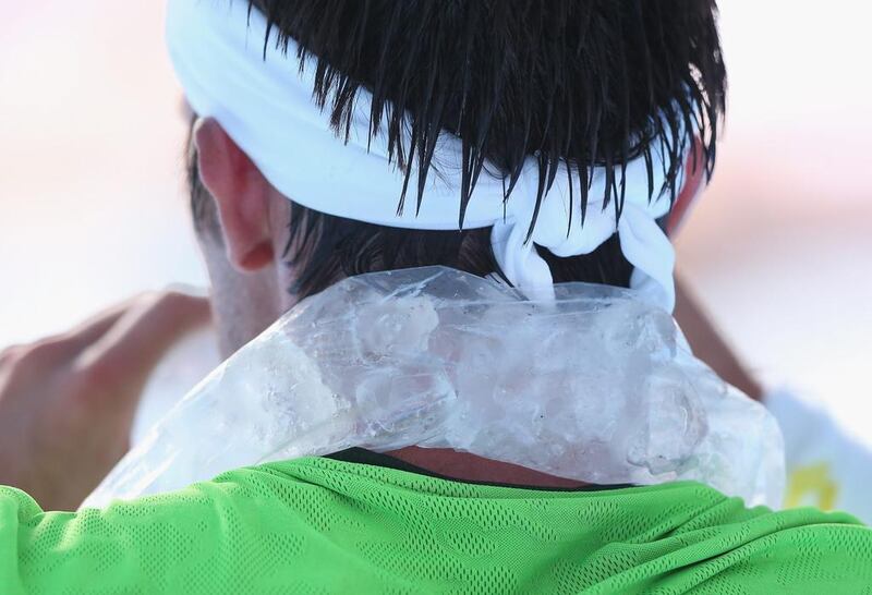 A player cools off with a bag of ice during a match at the third day of the Australian Open.