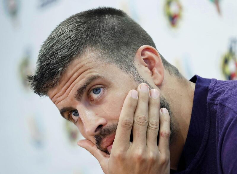 epa06943717 FC Barcelona's defender Gerard Pique attends a press conference in Barcelona, Spain, 11 August 2018. FC Barcelona will face FC Sevilla in the Spanish Super Cup at Stade Ibn Battouta in Tanger, Morocco, on 12 August 2018. Pique announced his retirement from the Spanish national soccer team.  EPA/ANDREU DALMAU