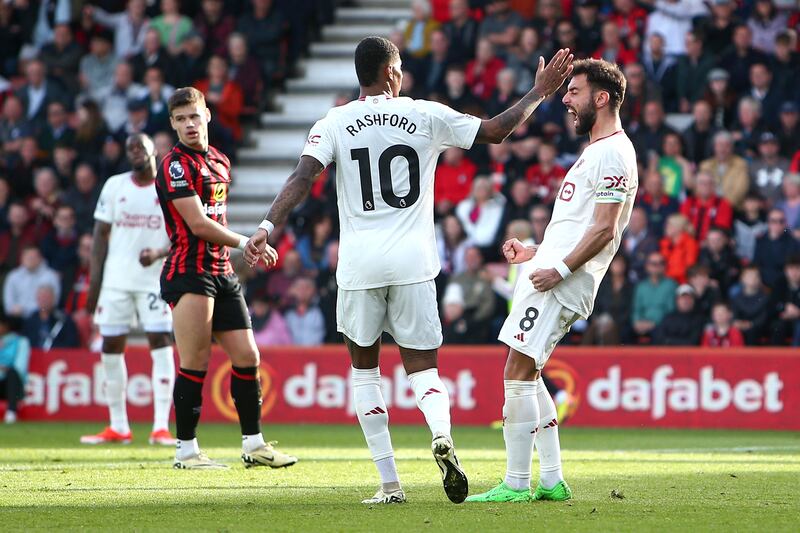 Bruno Fernandes of Manchester United celebrates scoring his team's first goal with teammate Marcus Rashford. Getty Images