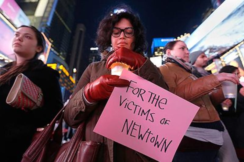 A candlelight vigil in Times Square, for the victims. Carlo Allegri / Reuters